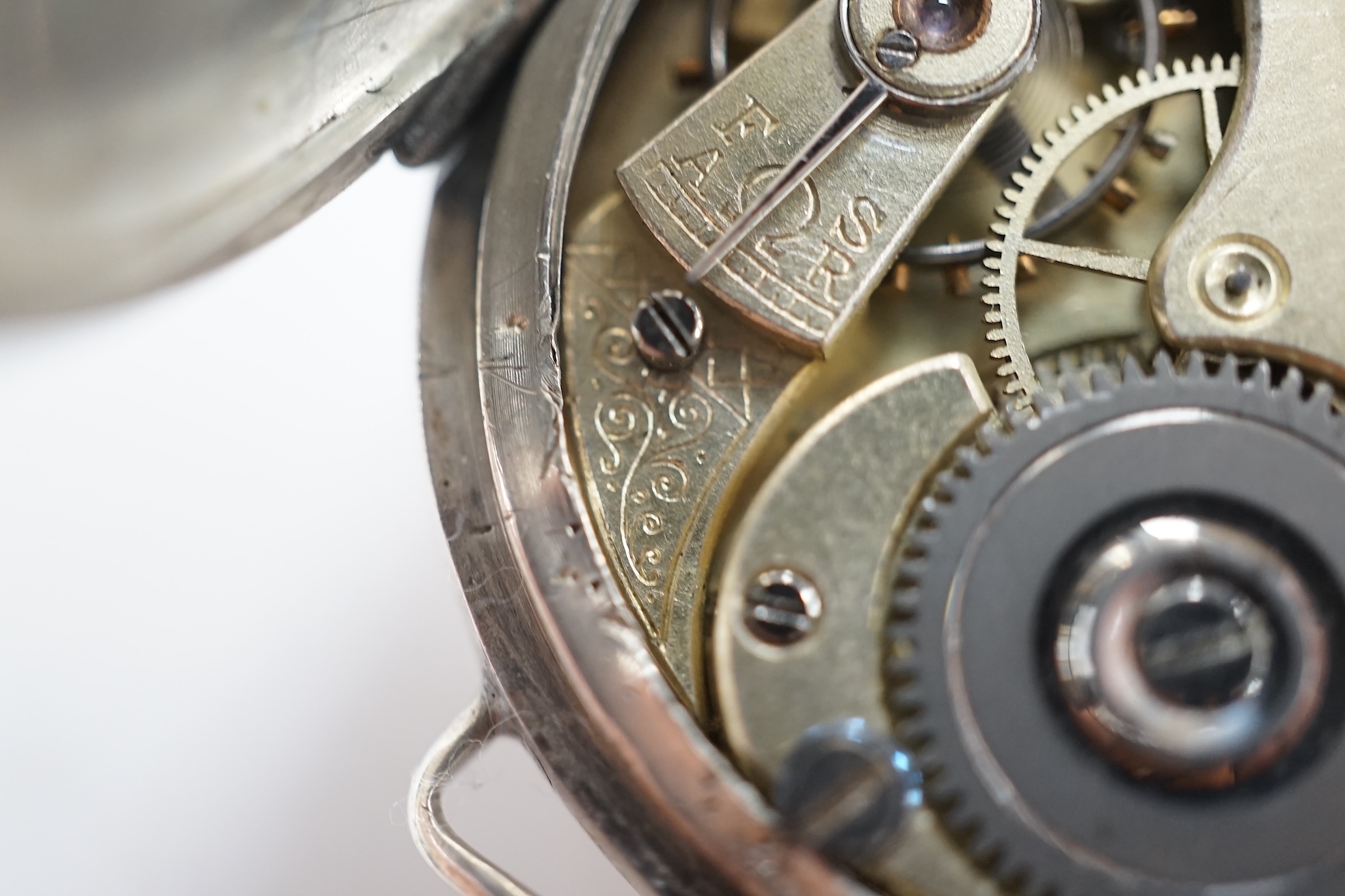 A George V silver manual wind trench watch with 'telephone dial' shrapnel guard, case import marked for London, 1917, case diameter 35mm, lacking winding crown. No strap. Condition - poor